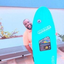 a man holding a surfboard