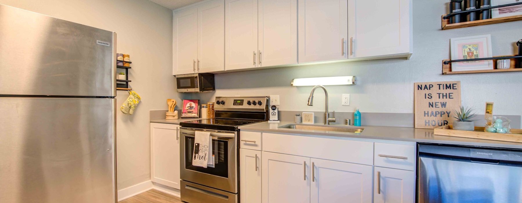 a kitchen with white cabinets