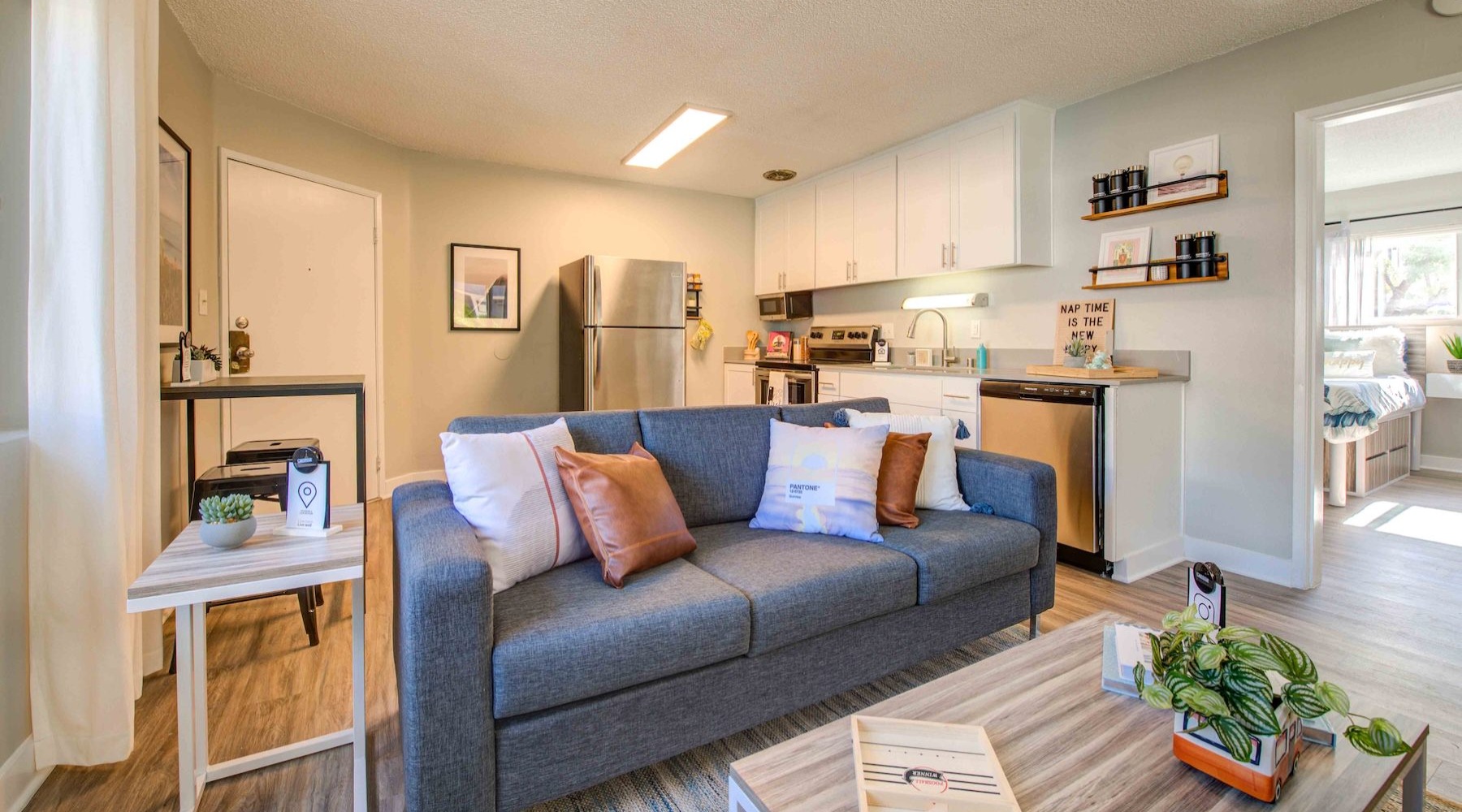 a living room with a couch and tables
